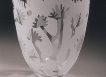 Vase. Blown glass with multiple stage carving